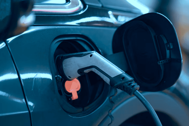 A petrol pump inserted into a car