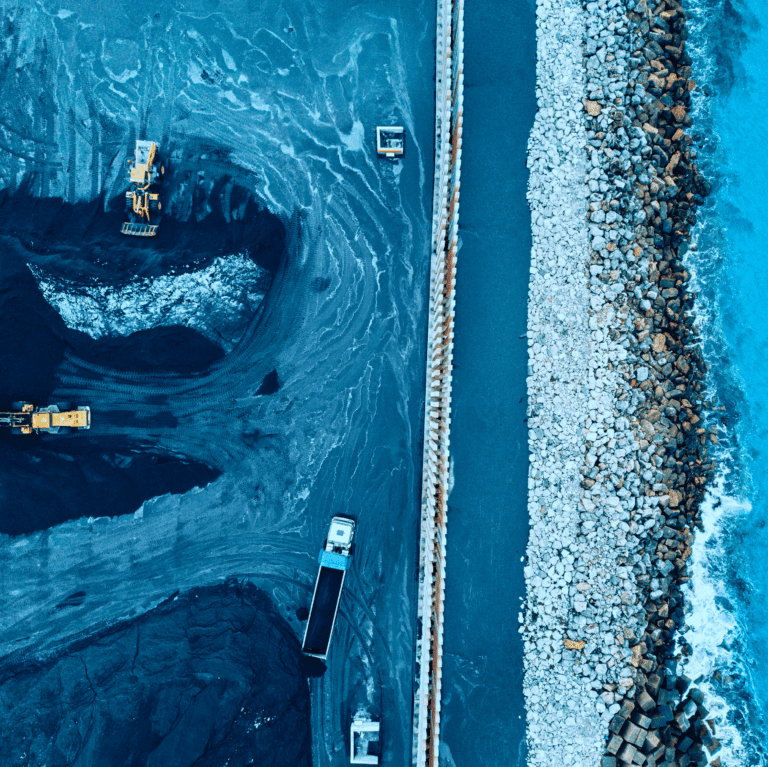 Aerial shot of a construction site by the sea